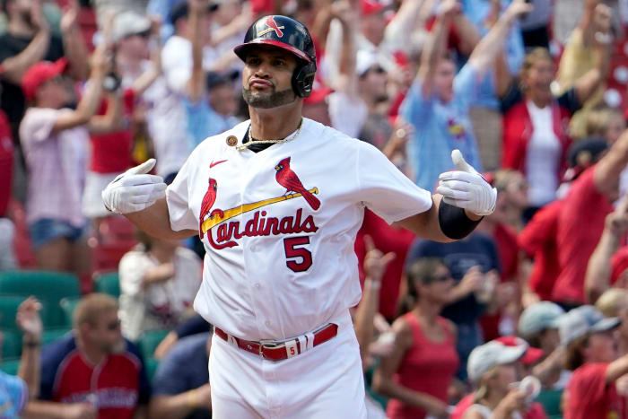 St. Louis Cardinals’ Albert Pujols celebrates after hitting a three-run home run during the eighth inning of a baseball game against the Milwaukee Brewers Sunday, Aug. 14, 2022, in St. Louis.